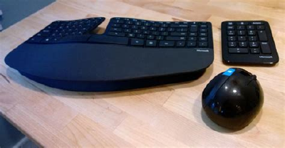 This is how the Sculpt looks like. You can see the weirdly separate numpad that I rarely used, and at the bottom of the keyboard, the plastic riser/tilt extra piece that snaps to the keyboard magnetically. (Image taken from [ITProToday's review](https://www.itprotoday.com/windows-server/microsoft-sculpt-ergonomic-desktop-review).)